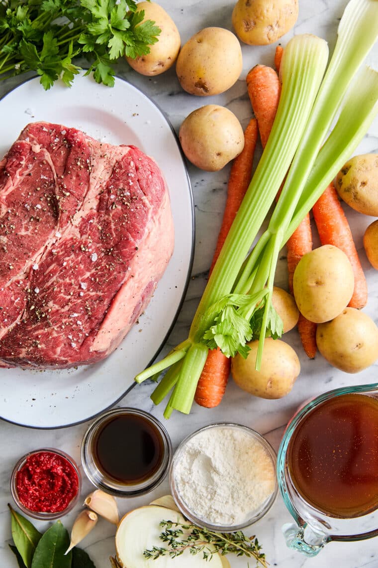 Slow Cooker Pot Roast - No-fuss, fall-apart pot roast made in your crockpot with the most tender vegetables! And the gravy is perfection.
