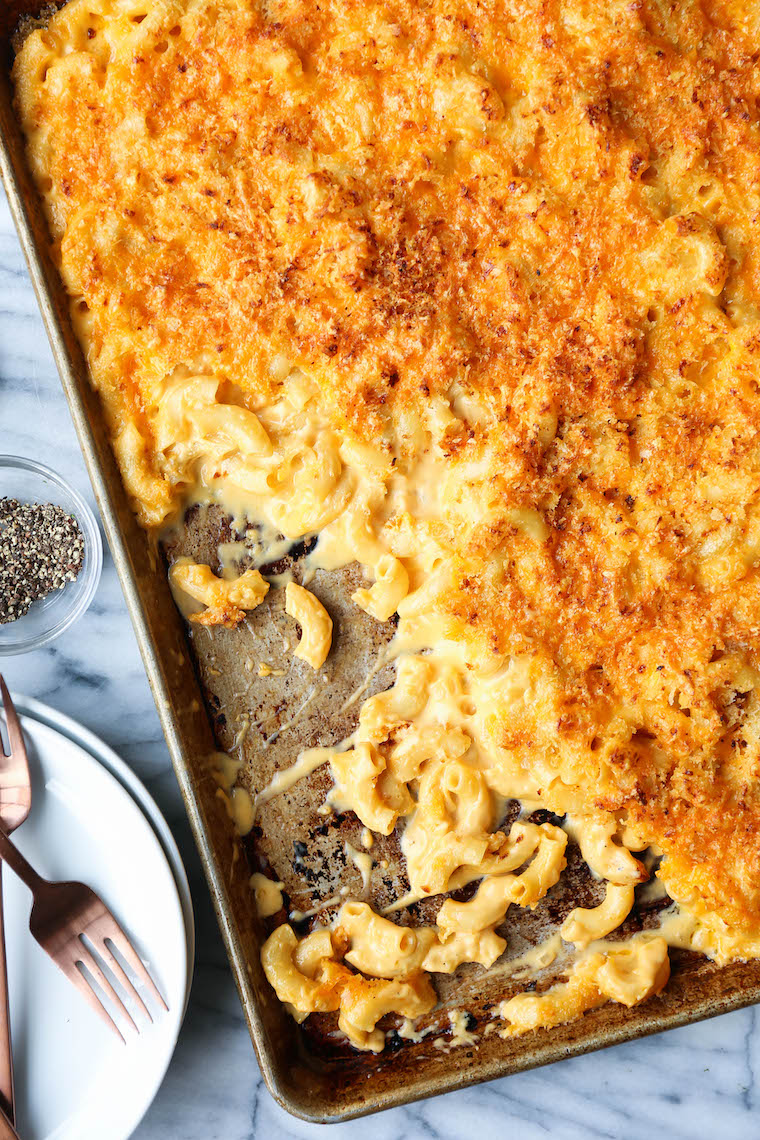Sheet Pan Mac and Cheese - Crowd-pleasing mac and cheese on a sheet pan! Perfectly cheesy and creamy with the maximum amount of crunchy bits. MIND BLOWN.
