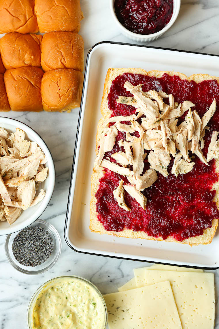 Leftover Thanksgiving Sliders - Leftover turkey, cranberry sauce, Dijon and melted cheese on super buttery Hawaiian rolls. Bake and serve warm! SO SO GOOD.