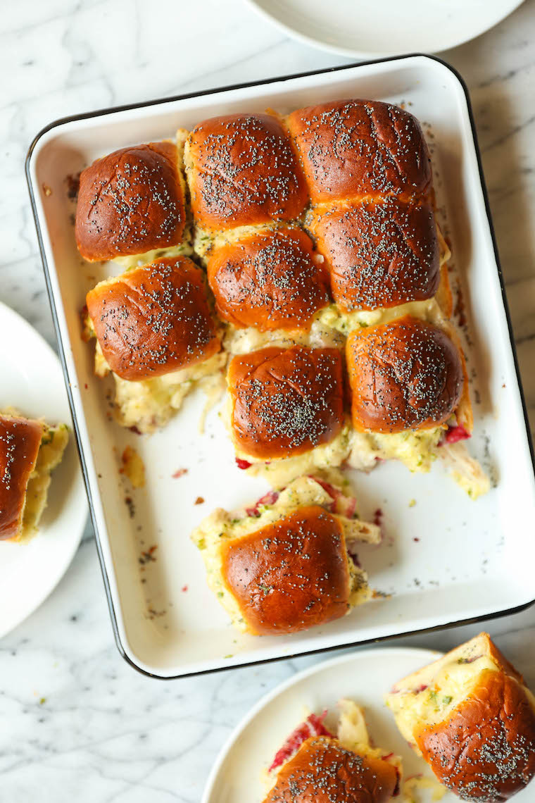 Leftover Thanksgiving Sliders - Leftover turkey, cranberry sauce, Dijon and melted cheese on super buttery Hawaiian rolls. Bake and serve warm! SO SO GOOD.