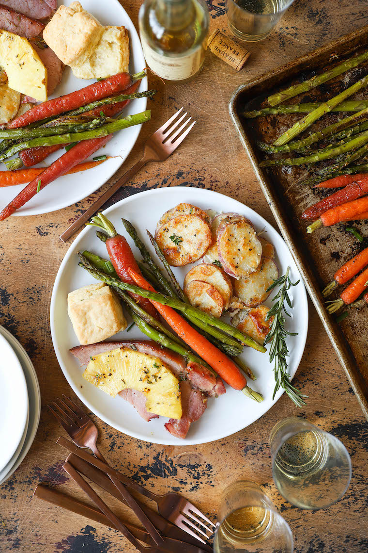 Sheet Pan Easter Dinner - Pineapple ham, scalloped potatoes, lemon garlic asparagus, honey roasted carrots, and fluffy mile-high biscuits on TWO SHEET PANS!