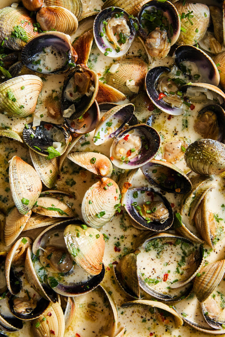 Garlic Butter Clams with White Wine Cream Sauce - The BEST steamed clams ever! So garlicky and buttery, served with a heavenly cream sauce!