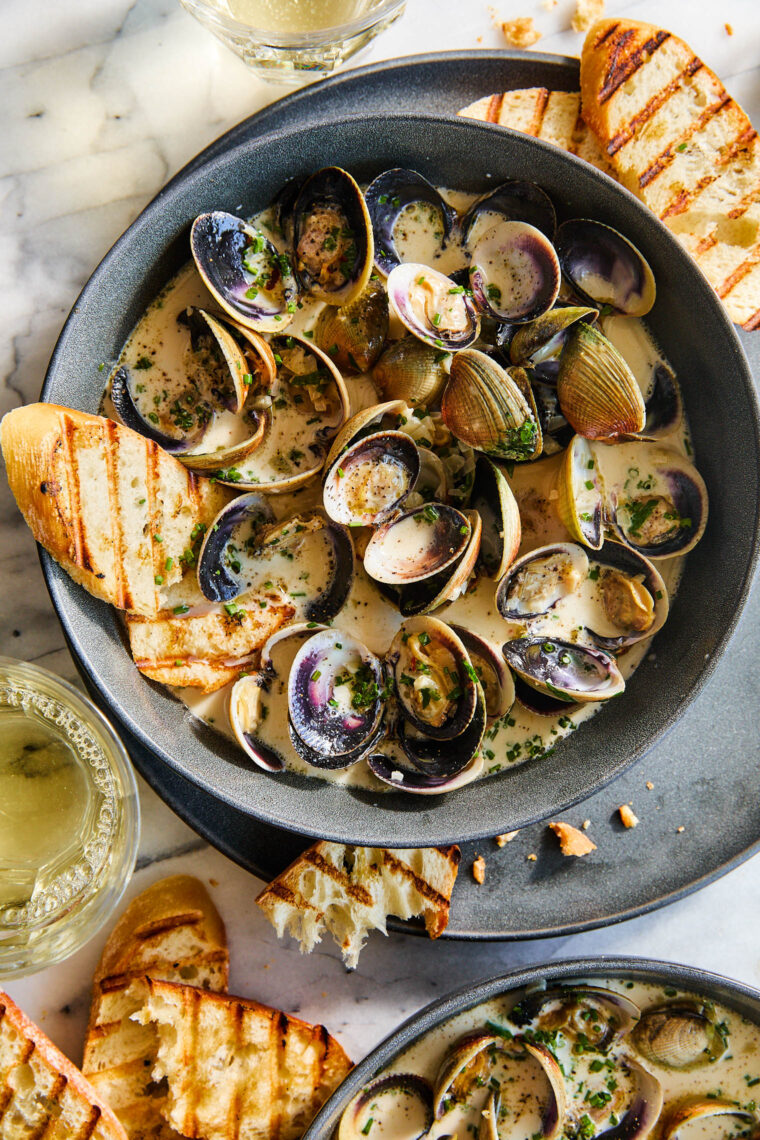 Garlic Butter Clams with White Wine Cream Sauce - The BEST steamed clams ever! So garlicky and buttery, served with a heavenly cream sauce!