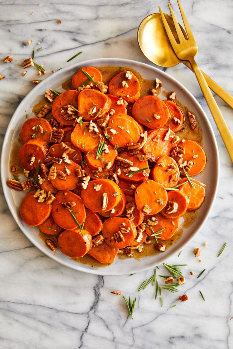 Candied Yams - How to make THE BEST homemade candied yams ever! Coated in butter, sugar, cinnamon and nutmeg. So stinking easy (and so good!).