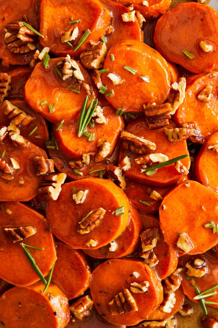 Candied Yams - How to make THE BEST homemade candied yams ever! Coated in butter, sugar, cinnamon and nutmeg. So stinking easy (and so good!).