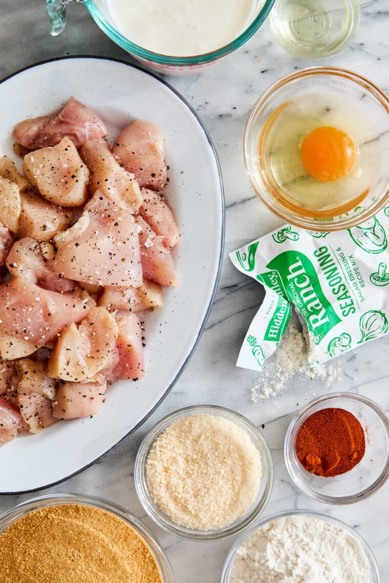 Baked Chicken Nuggets - The BEST crisp-tender chicken nuggets that are completely oven baked! Serve with ketchup, honey mustard or Ranch!