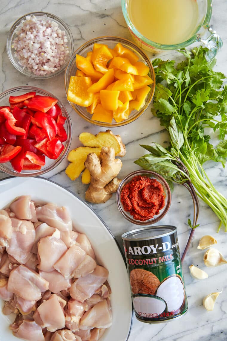 Coconut Curry Chicken - 1000x better than takeout! Tender chicken + veggies in a heavenly curry sauce. Serve over rice to sop up everything!