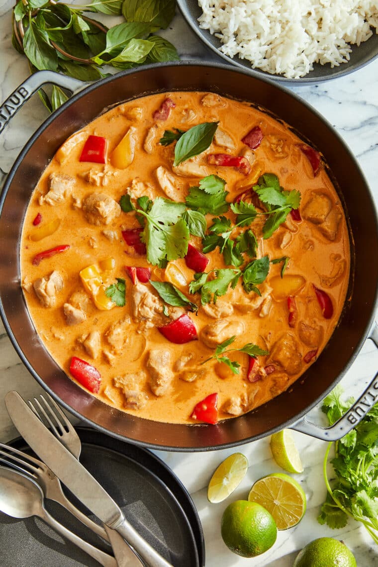 Coconut Curry Chicken - 1000x better than takeout! Tender chicken + veggies in a heavenly curry sauce. Serve over rice to sop up everything!