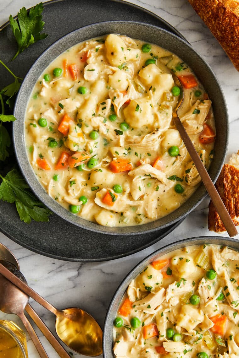 Chicken and Dumplings - A creamy, hearty chicken stew with vegetables and homemade light and fluffy dumplings! Comes together so quick too!