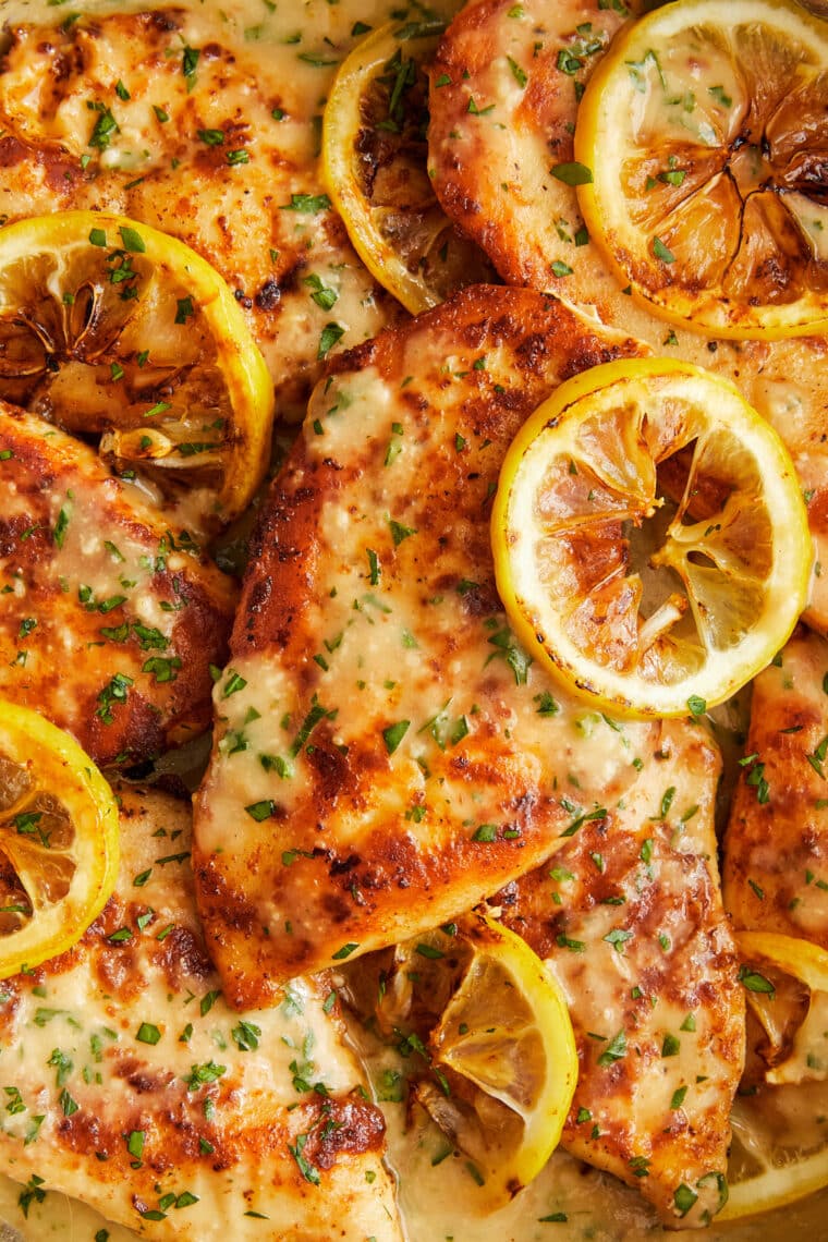 Parmesan Lemon Chicken - Golden brown, juicy, tender, parmesan-crusted chicken breasts in a creamy, lemon-garlicky sauce made in 30 minutes!
