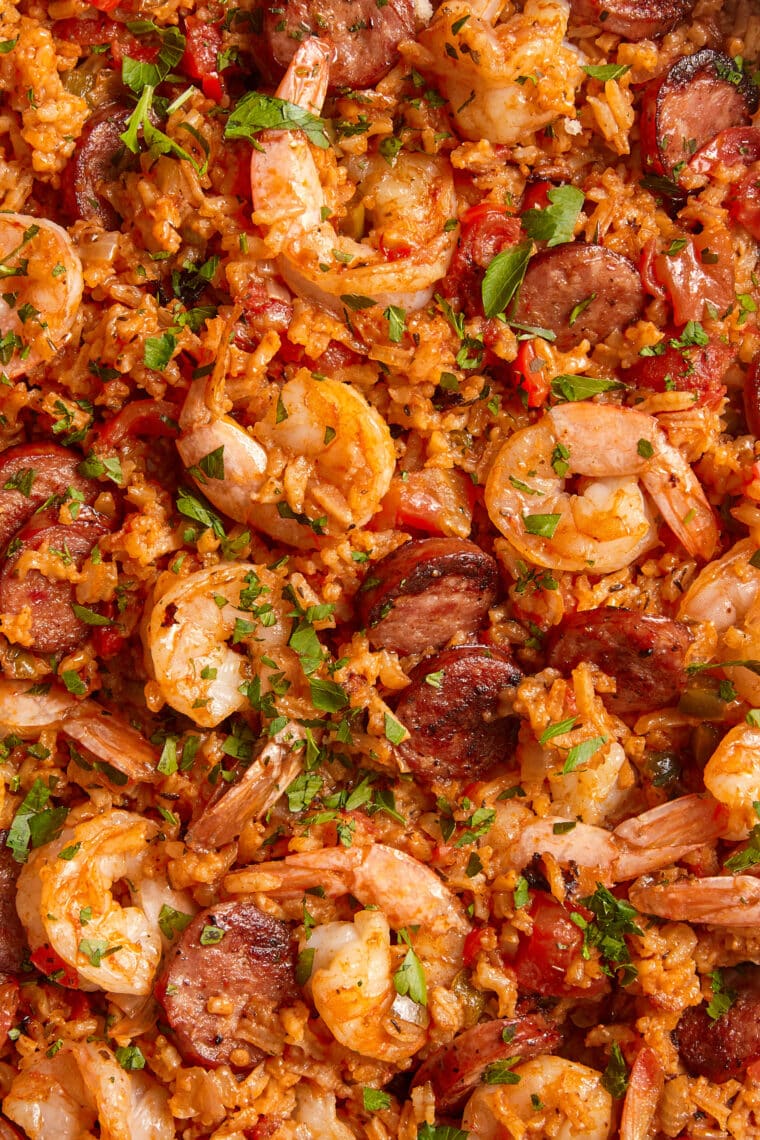Bowl of homemade jambalaya with shrimp, sausage, peppers, and parsley