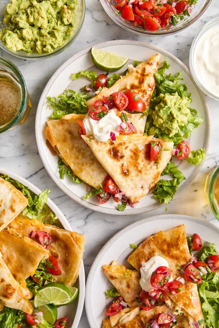 Easy Chicken Quesadillas - The best cheesy quesadillas! Golden brown crispy on the outside, perfectly melted on the inside. A 20 min recipe!