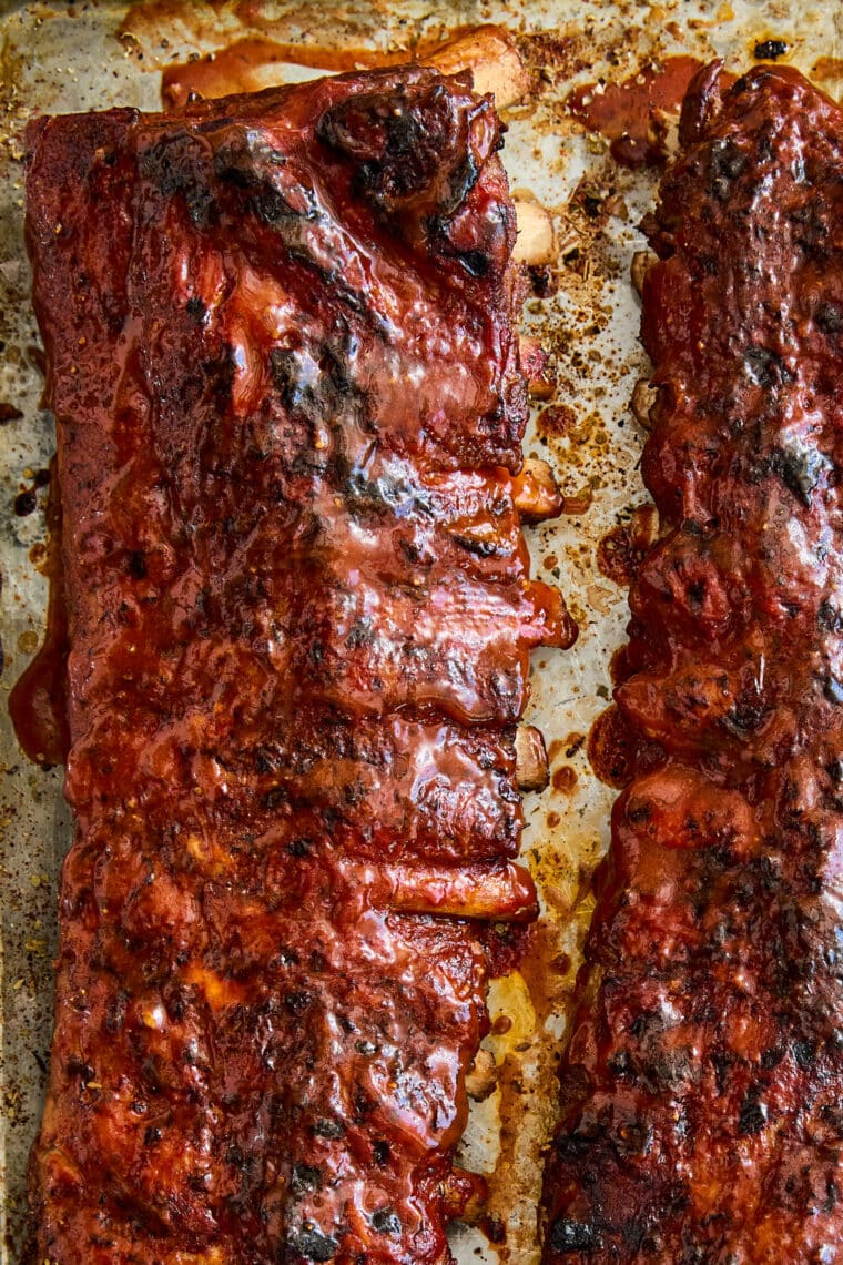 Easy Instant Pot BBQ Ribs - The easiest ribs ever made in less than 1 hr! So saucy, sticky, and tender, it just falls off-the-bone! So good.