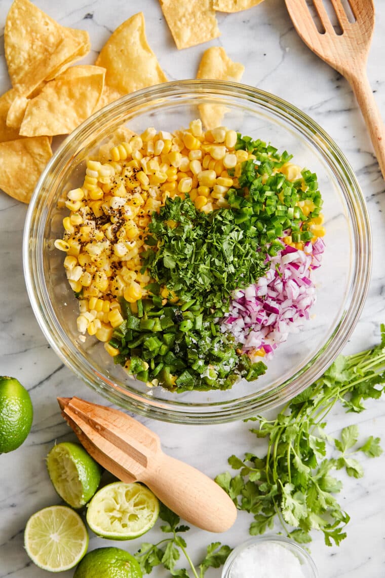 Corn Salsa - Oh so easy, fresh, homemade corn salsa! Made in minutes, perfect with chips or topped on burrito bowls, tacos + quesadillas!!!