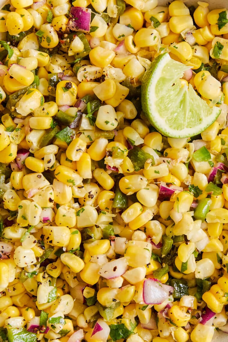 Corn Salsa - Oh so easy, fresh, homemade corn salsa! Made in minutes, perfect with chips or topped on burrito bowls, tacos + quesadillas!!!