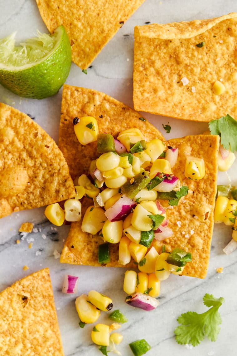 Corn Salsa - Oh so easy, fresh, homemade corn salsa! Made in minutes, perfect with chips or topped on burrito bowls, tacos + quesadillas!!!